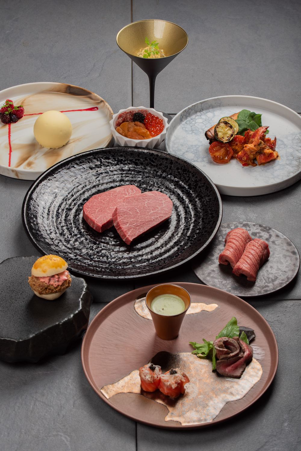 Christmas Itadaki Dinner Course at Ushiurara in Yokohama: two thick-cut pieces of A5 female Wagyu Chateaubriand ready for the grill, with seared lobster, beef tongue, a Chateaubriand katsu mini burger and Wagyu tartare with sea urchin, salmon roe and caviar